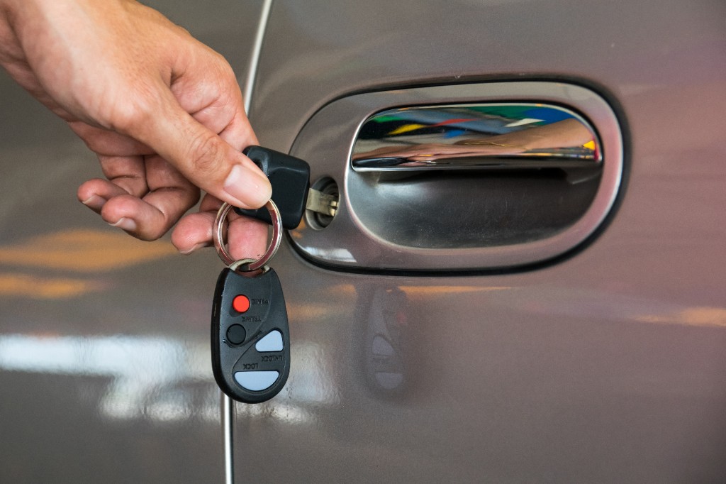 Key being inserted into a car door lock